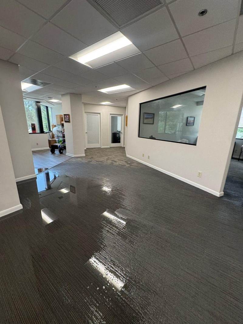 Flooded office hallway in a Texas commercial building