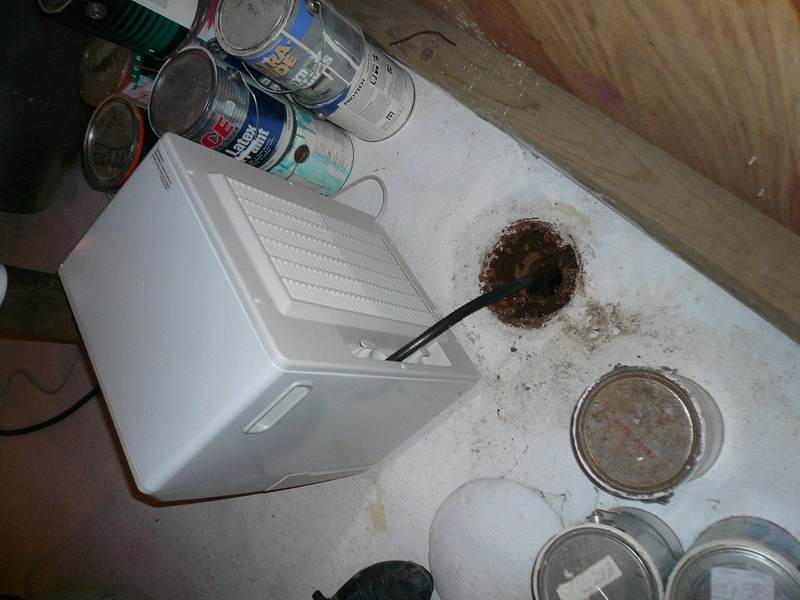 Dehumidifiers and air movers drying a Pinehurst TX home interior in humid conditions
