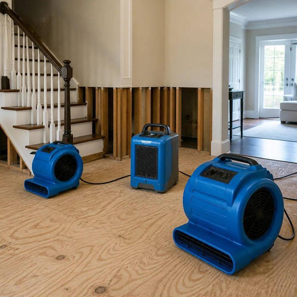 Industrial air movers drying a Springtown Texas home interior after water damage