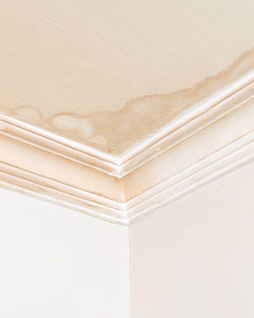 Water stain spreading across a Texas home ceiling from a hidden leak
